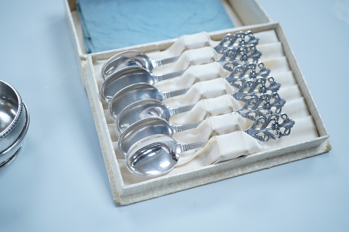 Small silver including a three piece cruet set, by George Howson, Sheffield, 1924/5/6, a napkin ring, a cream jug and a set of six 830s coffee spoons.
